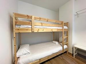 a couple of bunk beds in a room at Apartamentos Sierra Nevada 3000 in Sierra Nevada