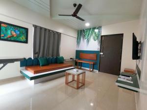 a living room with a couch and a table at Horizon Apartment 1BHK in Pune