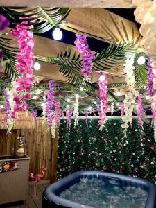 a room with a hot tub and a christmas tree at Stylish 3 bedroom seaside escape - newly renovated in Paignton