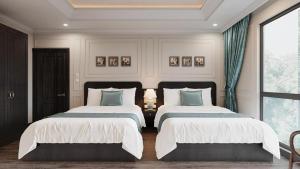 Łóżko lub łóżka w pokoju w obiekcie Đại Thủy Hotel CatBa