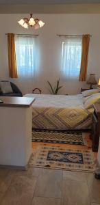 a bedroom with a bed with a rug on the floor at Cozy Home in the Heart of Cluj-Napoca in Cluj-Napoca