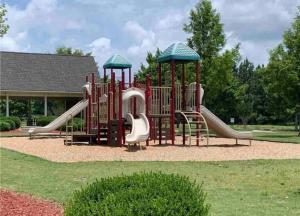 a playground with a slide at Beautiful Cozy 3-Bedroom Townhome Retreat in Atlanta