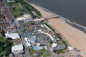 an aerial view of a beach and the ocean at Charlies in Skegness