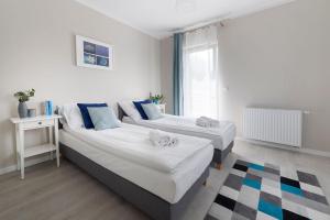 Posteľ alebo postele v izbe v ubytovaní Apartamenty-Kudowa z pięknym widokiem i balkonem