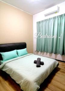 Voodi või voodid majutusasutuse Cozy Homestay (Beside Emart Batu Kawa) toas