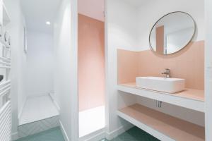 a bathroom with a sink and a mirror at T3 ** BALCON ** VIEUX PORT ** CENTRE in Marseille