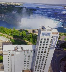 a large building with a view of the ocean at The Oakes Hotel Overlooking the Falls in Niagara Falls