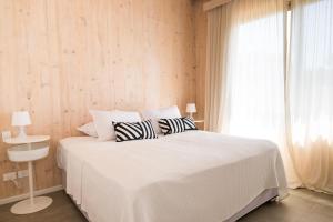 Anastasio Hotel & Beach Club客房内的一张或多张床位