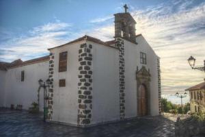 a white church with a cross on top of it at Teide Hideaway in Vilaflor