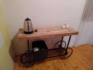 a table with a tea kettle on top of it at Apartments Elena & Damir in Vis