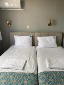Postel nebo postele na pokoji v ubytování GRAND Deniz Hotel