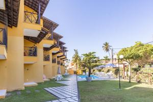 a view of the courtyard of a building with a pool at Merepe Residence in Porto De Galinhas