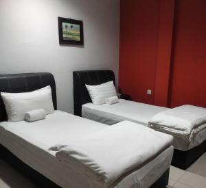 Postel nebo postele na pokoji v ubytování Reintree Lodge Hotel