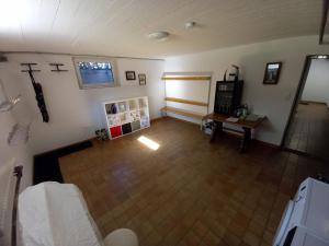 an overhead view of a living room with a cross on the wall at Ferienwohnung Bergtroll in Uderns