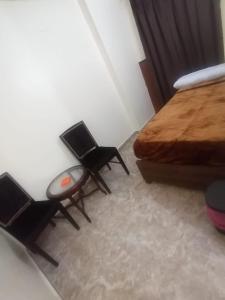 Postel nebo postele na pokoji v ubytování New Saint Catherine Hotel