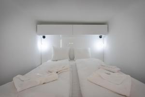 Voodi või voodid majutusasutuse Galaxy Cube Apartment toas