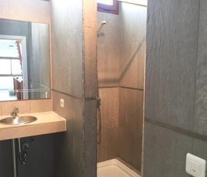 a bathroom with a shower with a sink and a mirror at El Olivo Beautiful Rural location 3 bed villa in Conil +7 photos