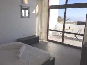 A bed or beds in a room at El Olivo Beautiful Rural location 3 bed villa