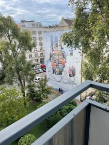 a balcony with a mural on the side of a building at Town Center Chmielna 116/118 in Warsaw