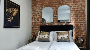 Łóżko lub łóżka w pokoju w obiekcie Apartamenty KB Toruń
