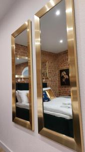 Łóżko lub łóżka w pokoju w obiekcie Apartamenty KB Toruń