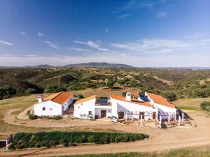 an aerial view of a farm with white buildings at Agroturismo Flores do Campo in Vila Verde de Ficalho