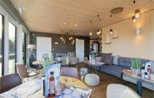 a living room with a couch and a table at Gorgeous Home In Lembruchdümmer See in Lembruch +40 photos