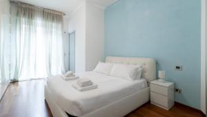 Tempat tidur dalam kamar di Italianway - Carducci 21