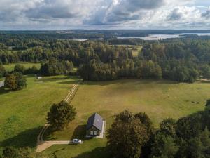 an aerial view of a small house in a field at Medsedis Plateliai in Plateliai