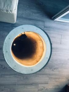 a cup of coffee sitting on top of a floor at Casa do Reguengo 1 in Estremoz