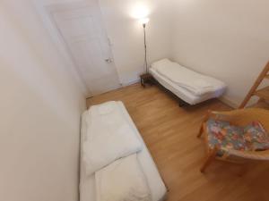 Voodi või voodid majutusasutuse Sonnegg Guest Rooms Inh M Bisegger toas