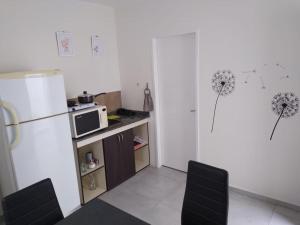 Kuchyň nebo kuchyňský kout v ubytování Departamento 1 Complejo Sol de Oeste + 13 fotografií