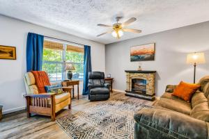 a living room with a couch and a fireplace at Pelican's Perch in Waynesville
