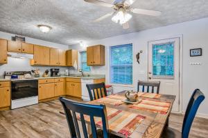 a kitchen and dining room with a table and chairs at Pelican's Perch in Waynesville