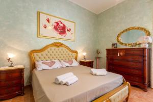 En eller flere senge i et værelse på Villa Acquamarina