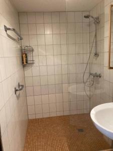 a bathroom with a shower and a sink at SauerlandBlick in Altena