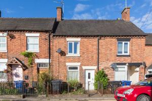 a brick house with a fence in front of it at Rocester Rest close to Alton Towers & JCB, Netflix in Rocester