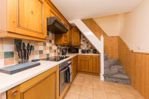 A kitchen or kitchenette at Rocester Rest close to Alton Towers & JCB, Netflix