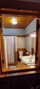 a bathroom with a tub and a toilet and a sink at Vivienda Turística Rural in Granada