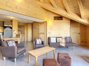a living room with chairs and tables in a cabin at Appartement La Toussuire, 4 pièces, 6 personnes - FR-1-416-68 in La Toussuire