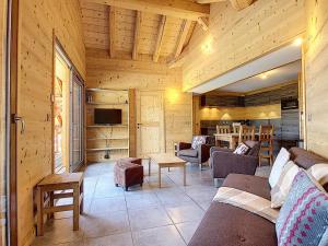 a living room with a couch and chairs in a cabin at Appartement La Toussuire, 4 pièces, 6 personnes - FR-1-416-68 in La Toussuire