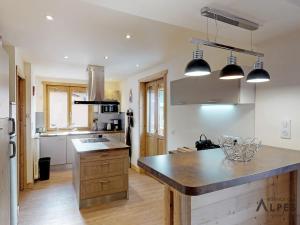 a kitchen with a large island in a kitchen at Appartement Saint-Martin-de-Belleville, 6 pièces, 12 personnes - FR-1-452-69 in Saint-Martin-de-Belleville