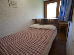 Ein Bett oder Betten in einem Zimmer der Unterkunft Appartement Les Menuires, 3 pièces, 8 personnes - FR-1-452-182