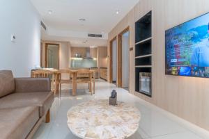 a living room with a couch and a table at The Rixx Premium Apartment (gym/pool/security) in Ho Chi Minh City