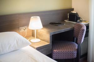 Postel nebo postele na pokoji v ubytování Hotel Montana