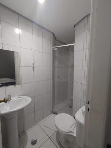 Een badkamer bij Hotel Caravelas