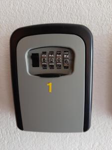 a black and white object with a remote control at APARTAMENTY TR 11 Apartament nr 1 in Olsztyn