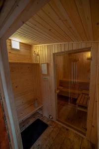 an inside view of a wooden cabin with a sauna at Apartamenty przy górskich rzekach in Nowy Targ