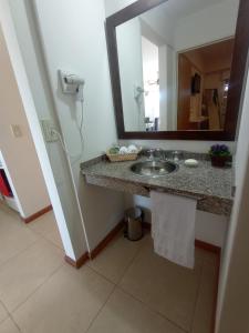 a bathroom with a sink and a mirror at Colina Dom in Victoria