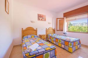 Posteľ alebo postele v izbe v ubytovaní Villa Bernia - PlusHolidays